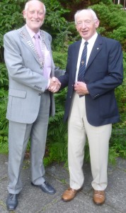 New President Douglas Haddow receives the chain of office from outgoing President Neil Beattie