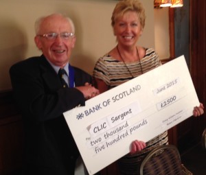 President Neil Beattie presenting a cheque for £2500 to May Gilchrist of CLIC Sargent